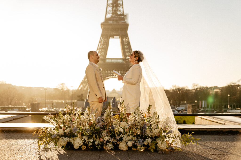 Paris Elopement Packages Elopement Photographer Videographer winter elopement couple ceremony flower decoration Eiffel Tower view 