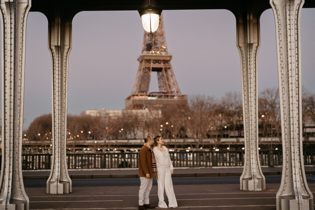 Paris Elopement Packages Elopement Photographer Videographer winter elopement couple Bir Hakeim Paris Eiffel Tower view 