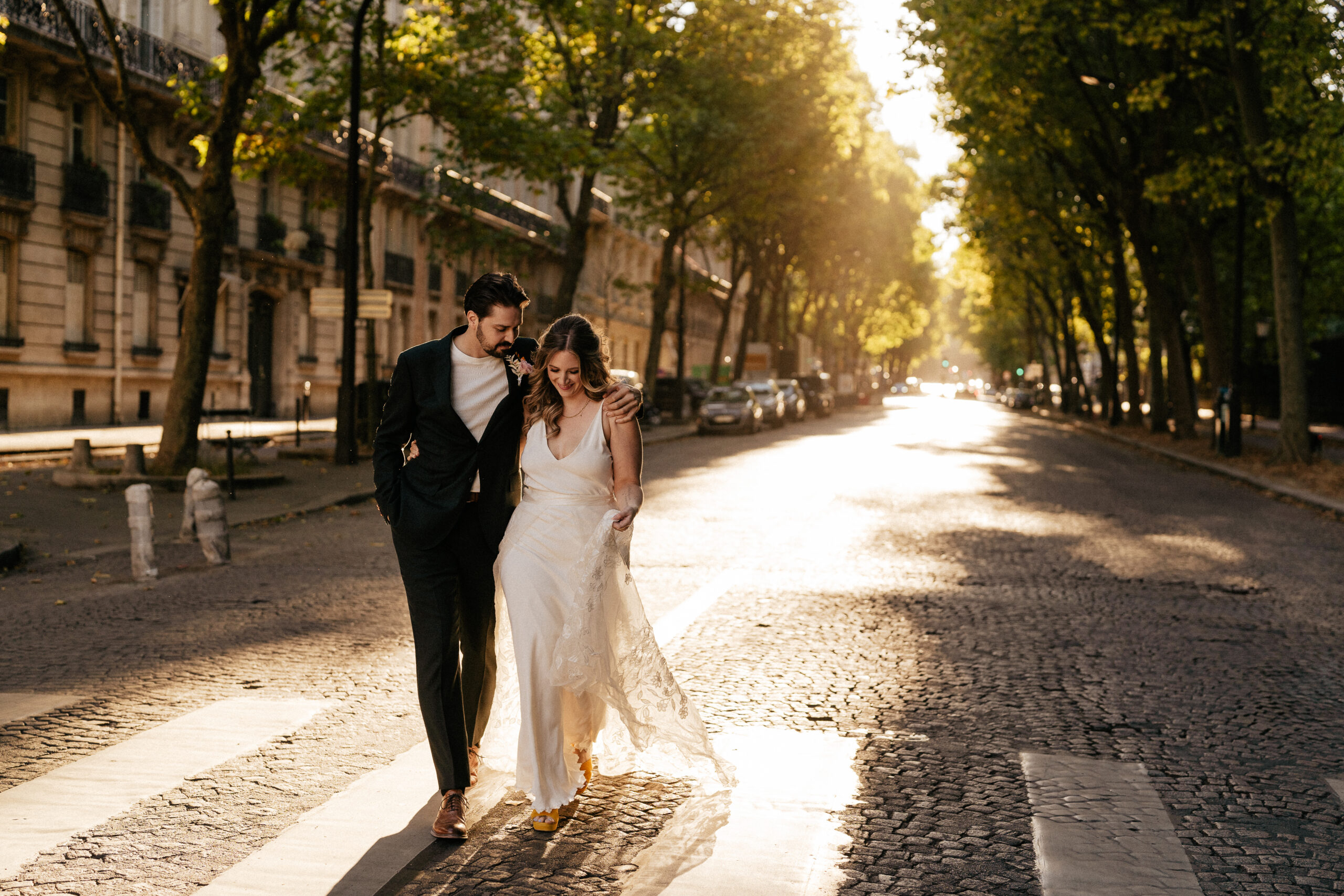 couple strolling on the parisian street at sunset