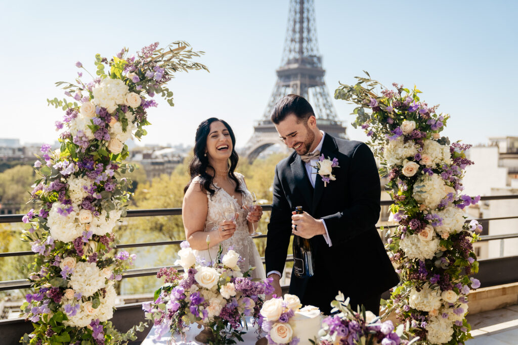 Destination Purple wedding elopement at Shangri-La Hotel Paris private rooftop Eiffel Tower view couple laughing