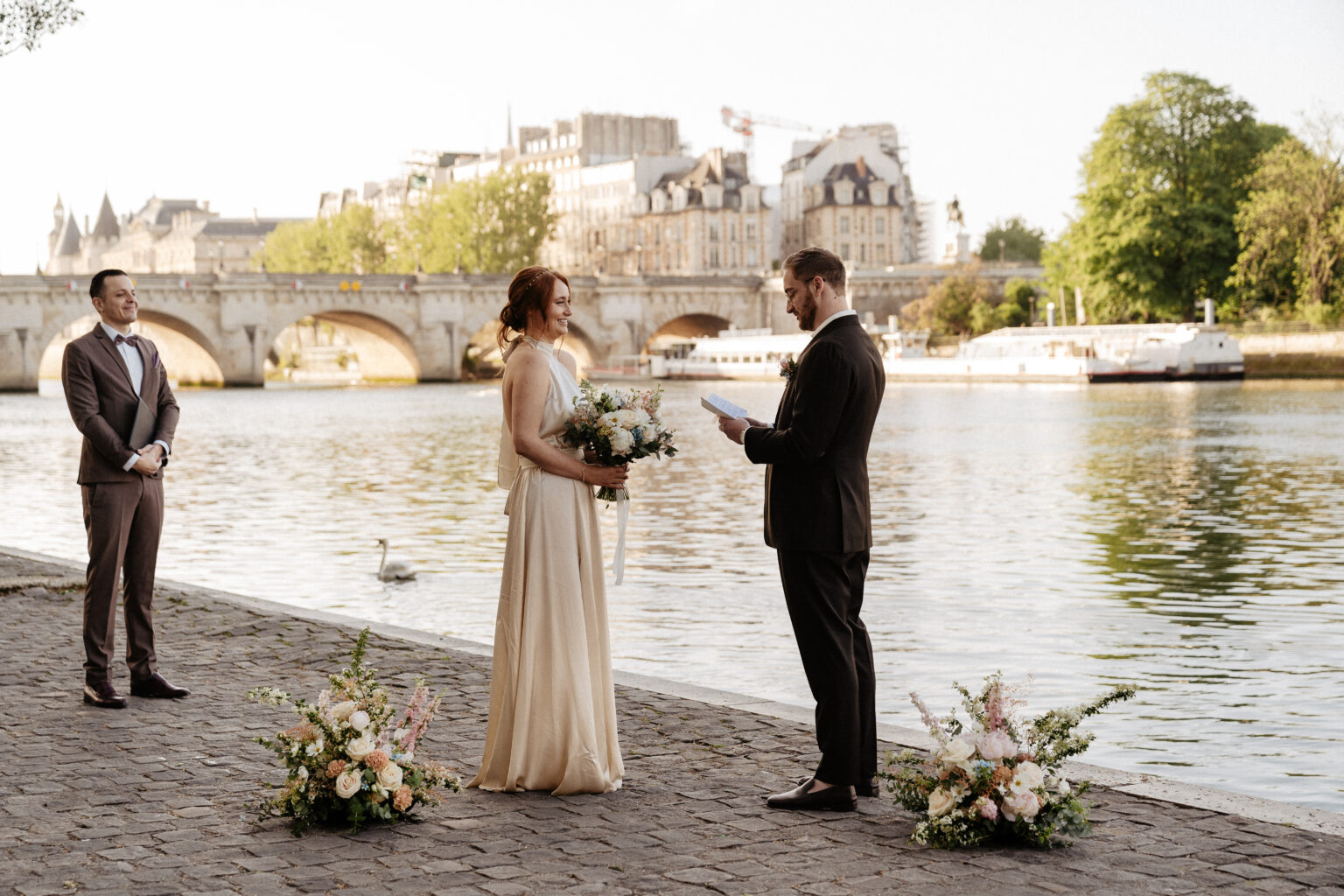 red hair bride and groom exchanges vows by the seine